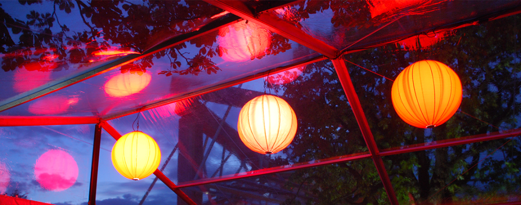 Softly lit paper globes for evening events